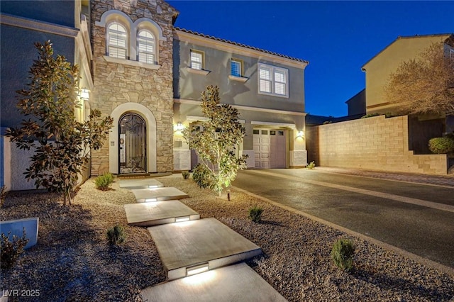 view of front of property featuring a garage