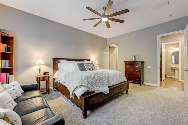 bedroom featuring light carpet and ceiling fan