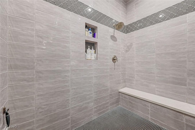 bathroom featuring tiled shower