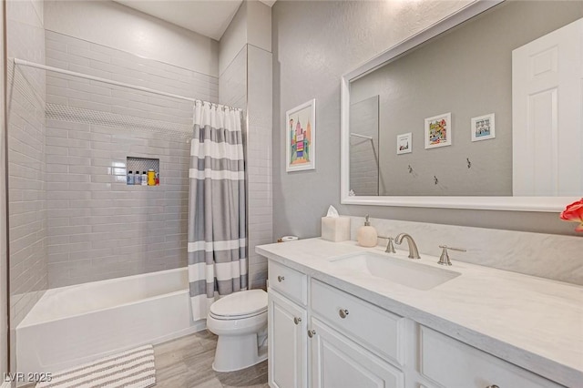 full bathroom featuring toilet, shower / bath combo, and vanity