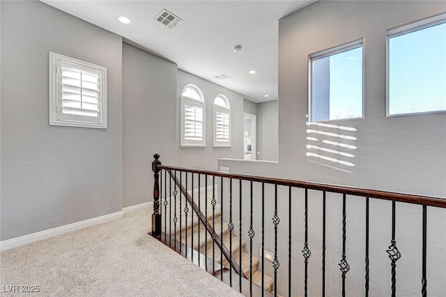 hallway featuring carpet flooring