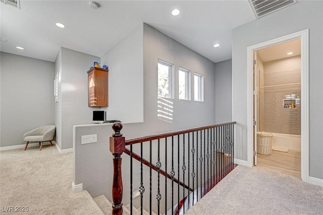 hallway with light carpet