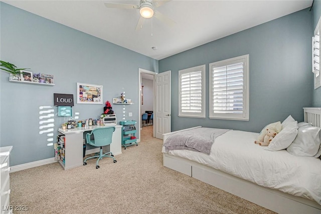 bedroom with ceiling fan and light colored carpet