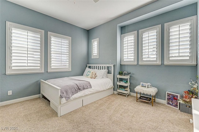 bedroom featuring light carpet