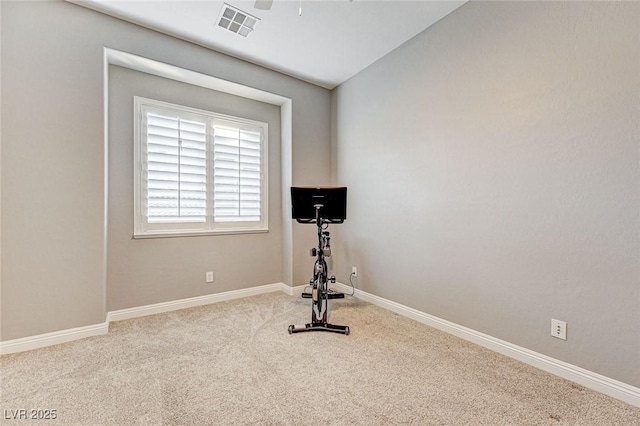 workout room featuring carpet and ceiling fan