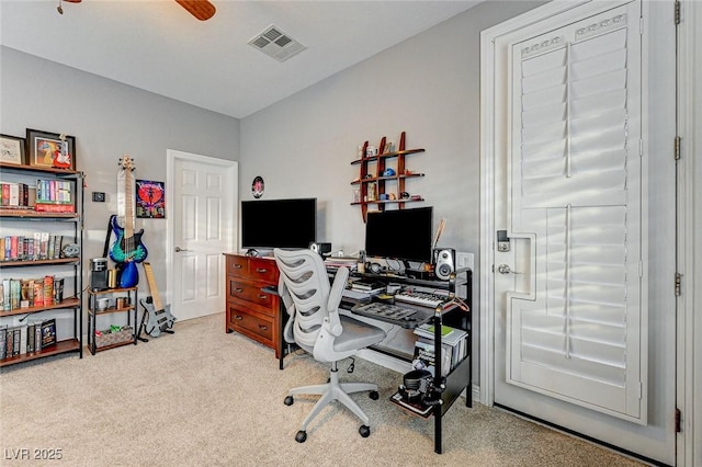 office area featuring ceiling fan and light carpet