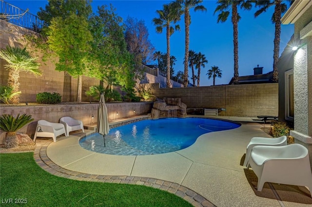 view of pool featuring pool water feature and a patio