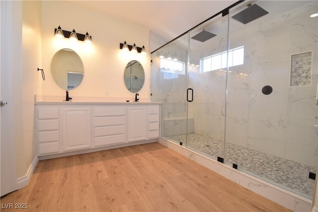 bathroom featuring vanity, hardwood / wood-style floors, and an enclosed shower