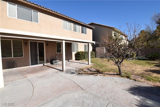 back of property featuring a patio area