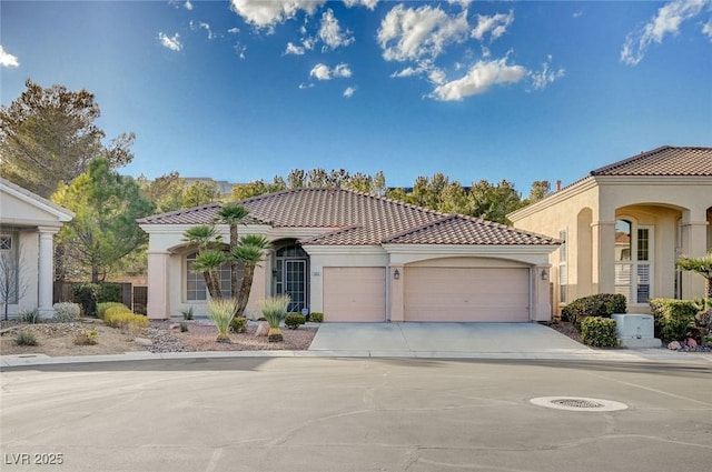 mediterranean / spanish house with a garage