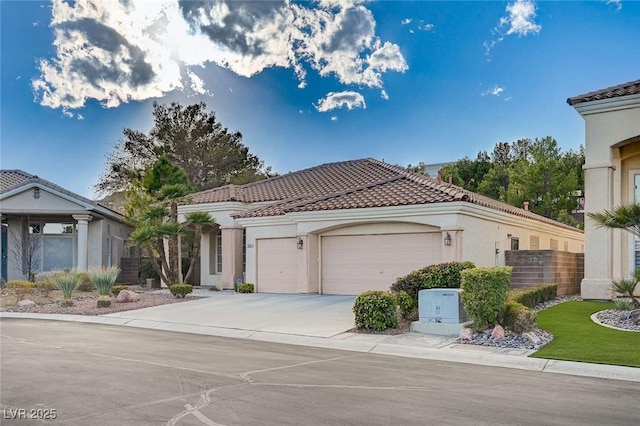 mediterranean / spanish house featuring a garage