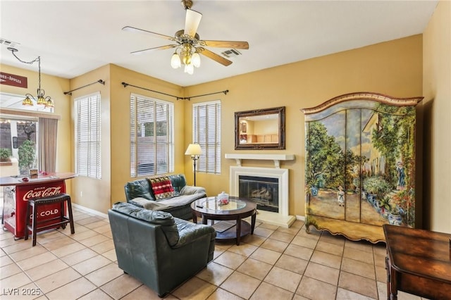 tiled living room featuring ceiling fan