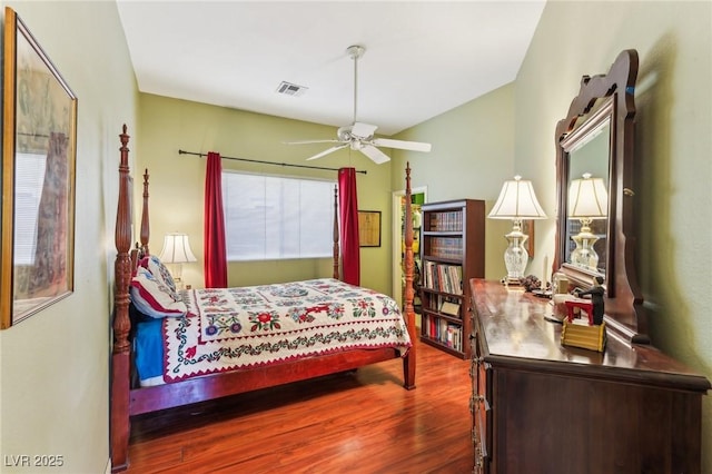 bedroom with hardwood / wood-style floors and ceiling fan