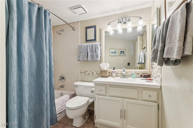 full bathroom featuring tile patterned floors, toilet, tasteful backsplash, shower / tub combo, and vanity