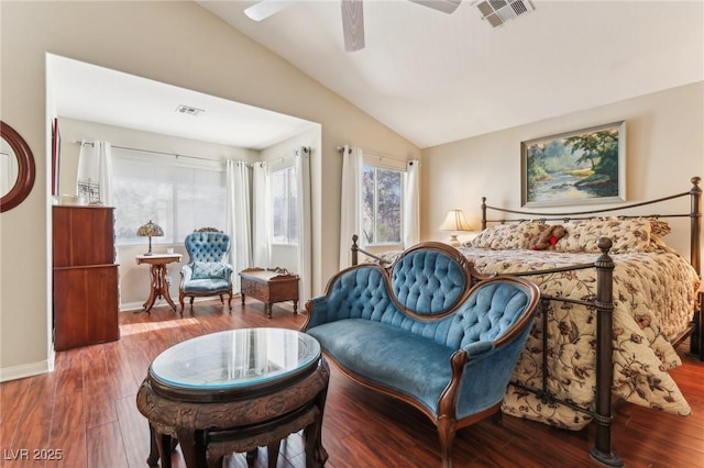 bedroom with ceiling fan, lofted ceiling, and wood-type flooring