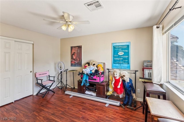 interior space with dark hardwood / wood-style floors and ceiling fan