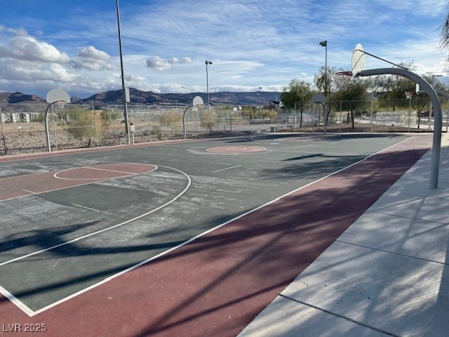 view of basketball court with a mountain view