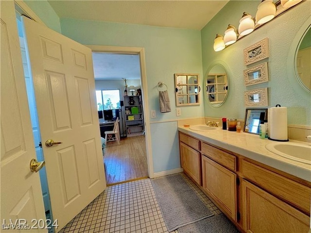 bathroom featuring vanity and tile patterned flooring