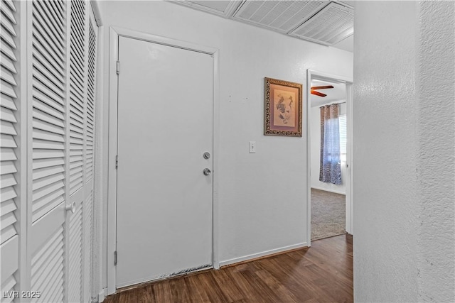 hall featuring dark wood-type flooring