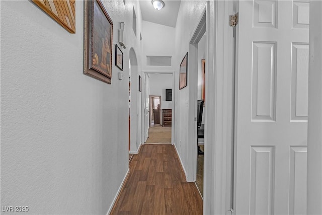 hallway featuring wood-type flooring