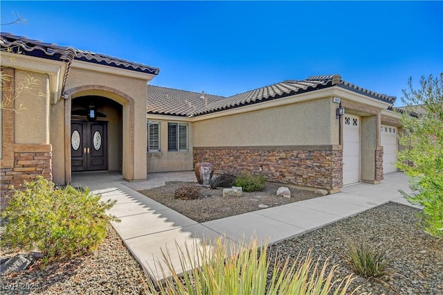 property entrance featuring a garage