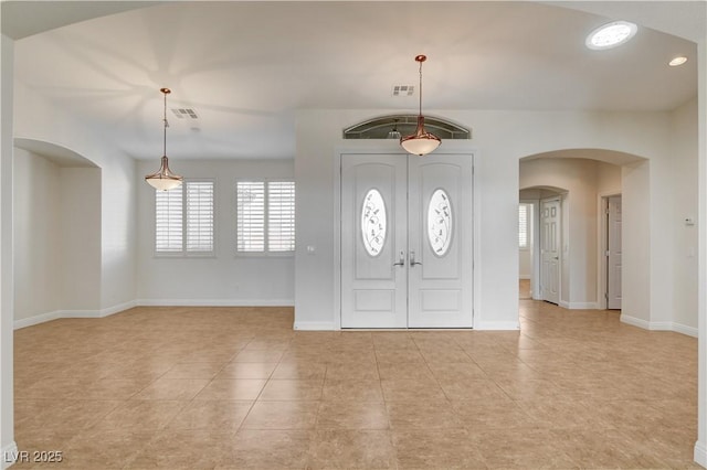 foyer entrance with light tile patterned floors