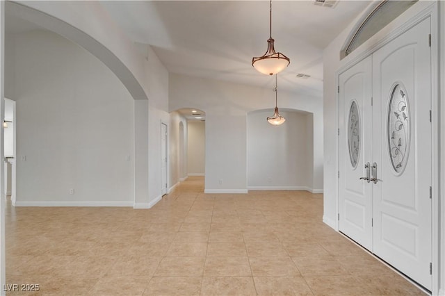 entryway with light tile patterned floors