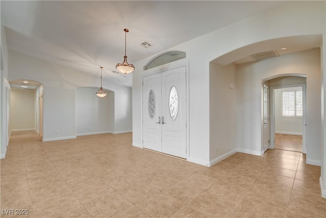 foyer entrance featuring light tile patterned flooring