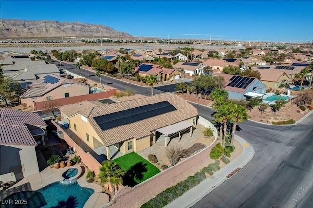 birds eye view of property with a mountain view