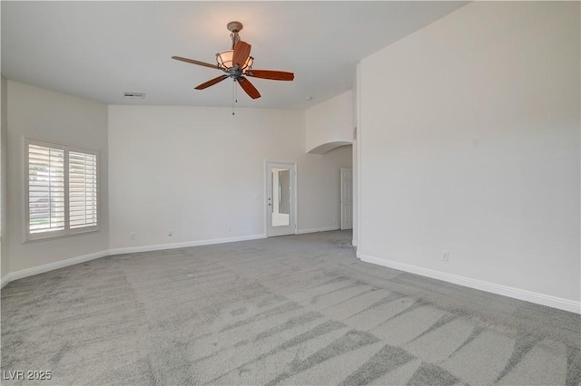 unfurnished room featuring light carpet and ceiling fan