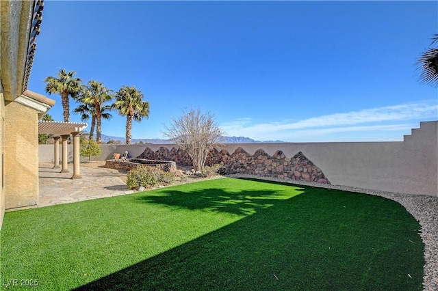 view of yard with a pergola and a patio