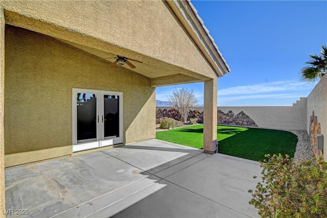 view of patio / terrace with french doors and ceiling fan