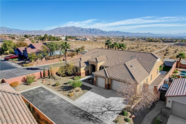 birds eye view of property with a mountain view