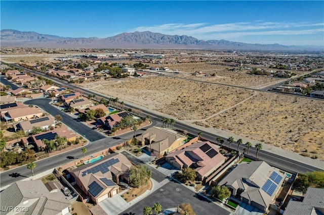 birds eye view of property with a mountain view