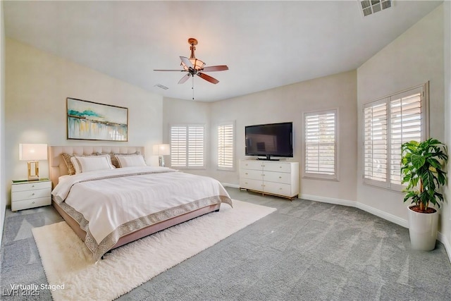 bedroom featuring ceiling fan and light colored carpet