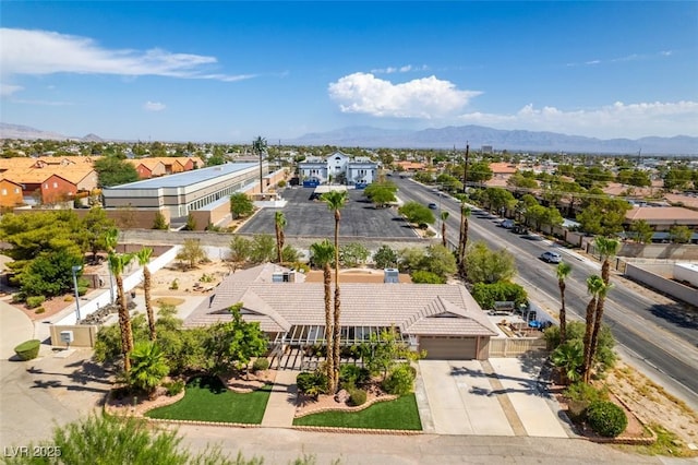 birds eye view of property featuring a mountain view