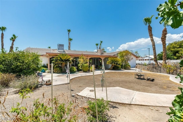 back of property with a patio and central air condition unit