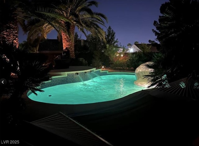 pool at twilight with an outdoor pool