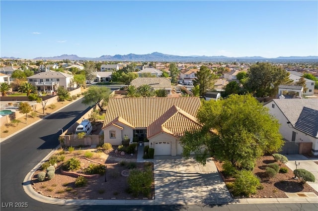 drone / aerial view with a residential view and a mountain view