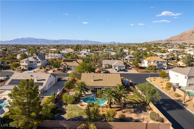 birds eye view of property featuring a mountain view and a residential view