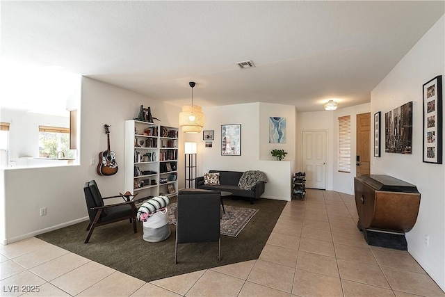 living area featuring visible vents and tile patterned floors