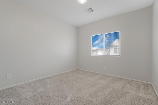 spare room with light colored carpet