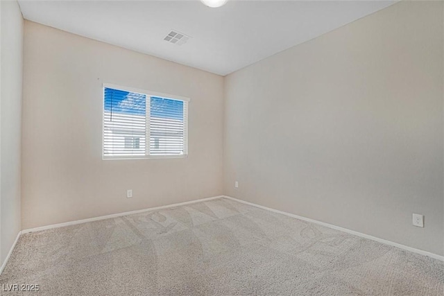 empty room featuring light carpet