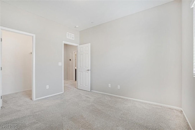 empty room with light colored carpet