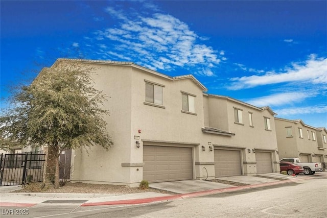 townhome / multi-family property featuring a garage