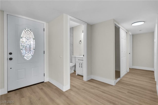 foyer entrance featuring light wood-type flooring