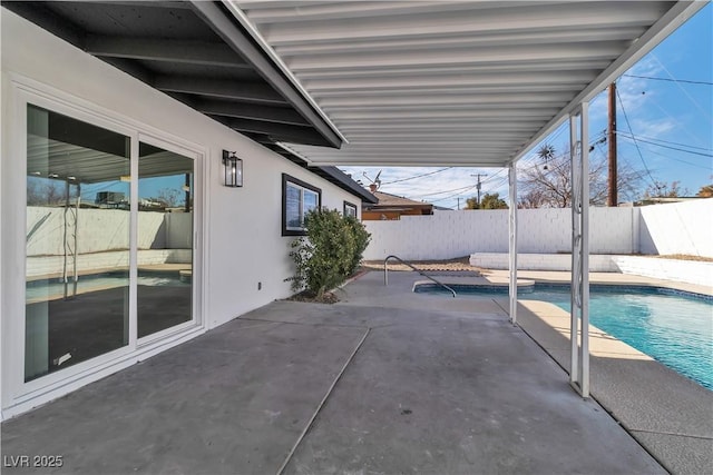 view of patio with a fenced in pool