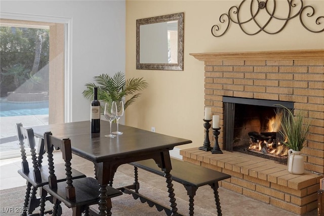 dining space with a fireplace