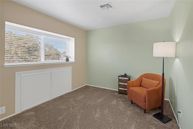 sitting room featuring carpet