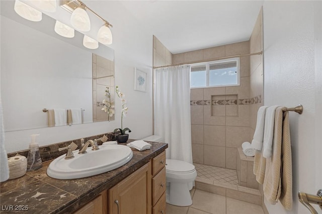 bathroom featuring tile patterned flooring, vanity, curtained shower, and toilet